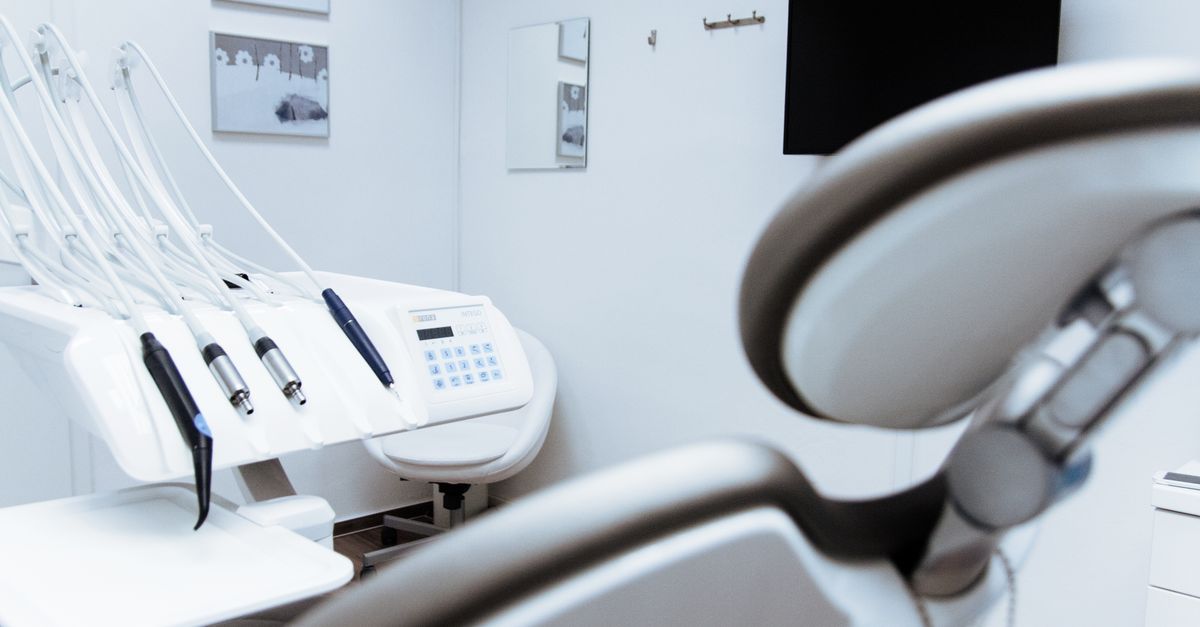 Modern dental clinic treatment room with a dentist's chair