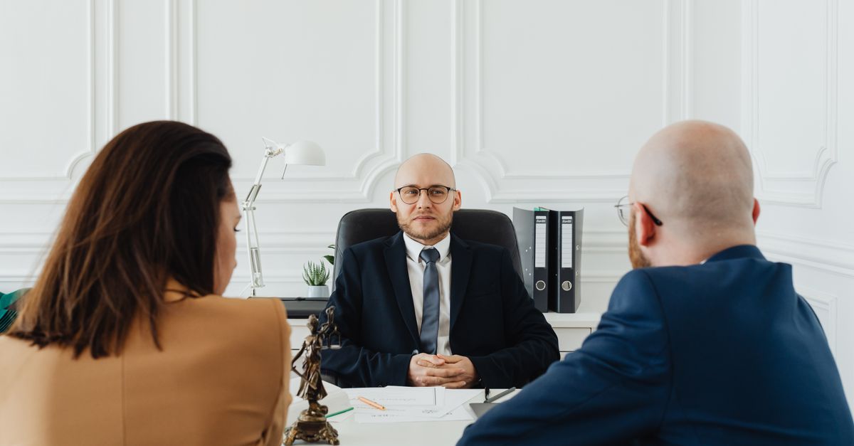 Lawyer talking to a new client across a desk