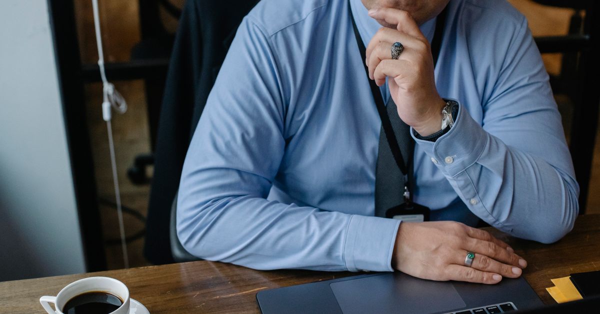 Business owner weighing two choices thoughtfully