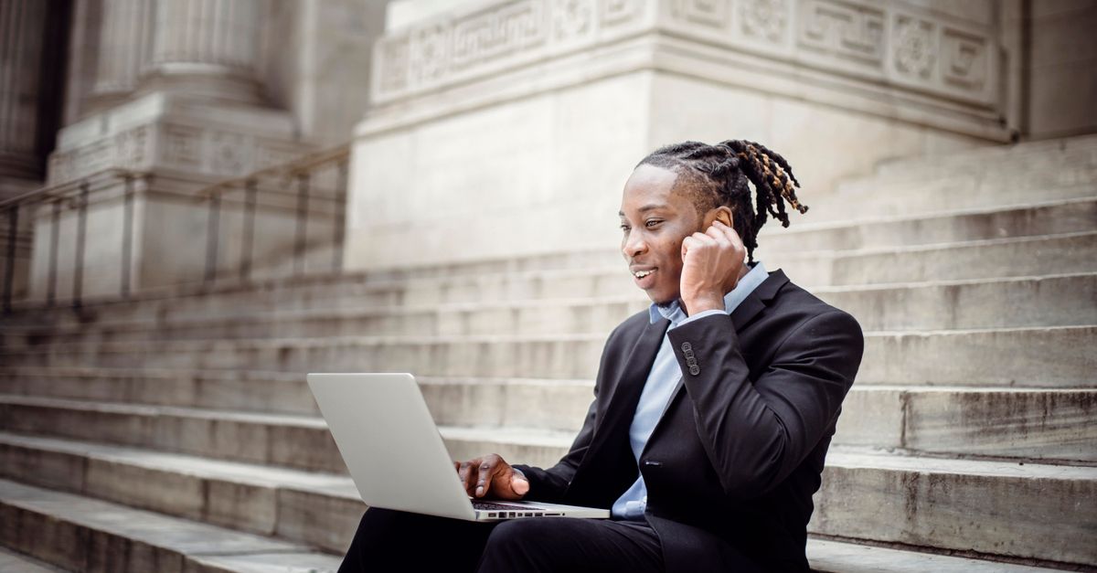 Salesperson making an outbound call from a laptop