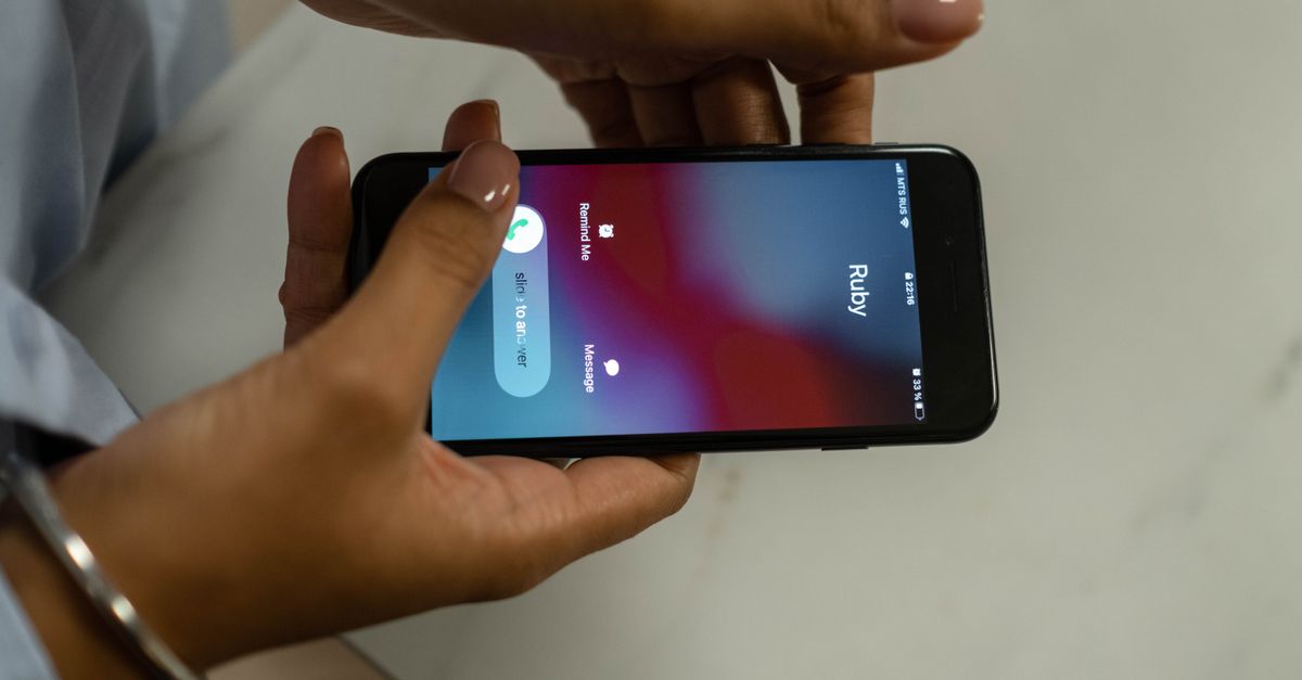 Phone showing an incoming call from a business