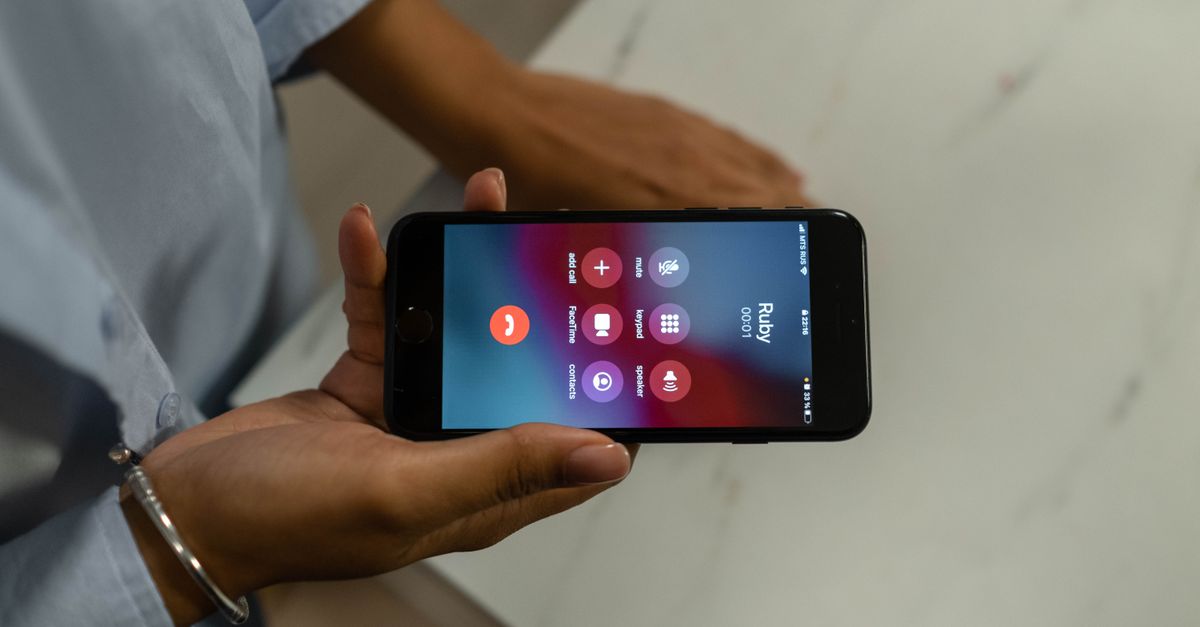 Smartphone showing a missed call notification on a desk