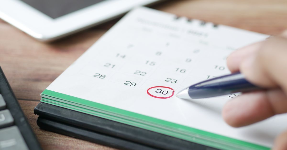 Calendar and smartphone used to schedule an appointment